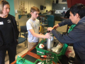 Trent works with Mr. Alaniz at the oxygen station.